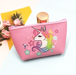 Pink unicorn coin purse made of cross-grain leather with colorful tassel and zipper detail