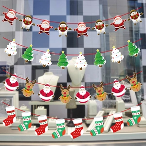 Detail view of colorful Santa Claus, snowman, and reindeer paper banners for Xmas decor