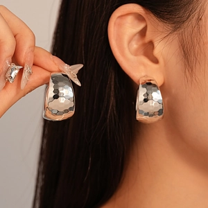 Silver hammered C-shape hoop earrings with vintage textured metal for elegant women