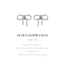 Detailed close-up of S925 sterling silver bow earrings with vintage rope texture design