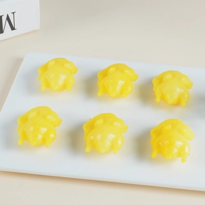 Miniature PVC salted duck food models in a white tray for dollhouse kitchen play