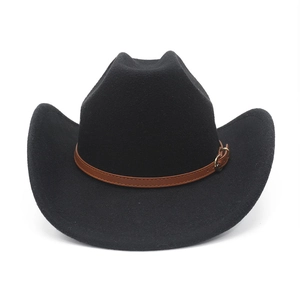 Detail of black wool felt cowboy hat with brown leather band and gold metal buckle