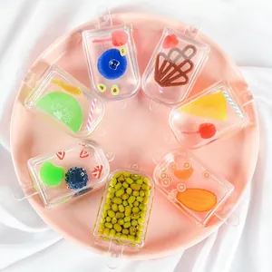 Creative resin popsicle charms featuring realistic fruit slices and waffle patterns on a tray
