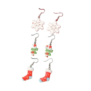 Christmas theme earring set with candy canes, snowflakes and stockings on white background