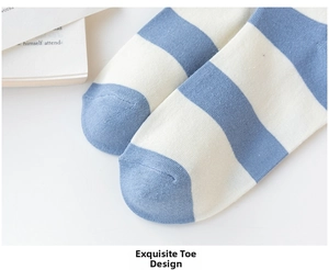 Detailed close-up showing the smooth toe seam and blue striped knit fabric of the sock