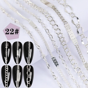 Detail of six silver nail art metal chains including twist and snake styles with demo
