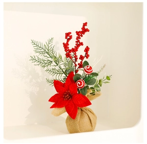 Macro detail of Christmas floral arrangement with red poinsettia and burlap base