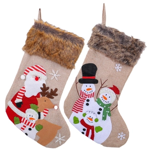Plush Christmas stockings with Santa, reindeer and snowman designs on white background