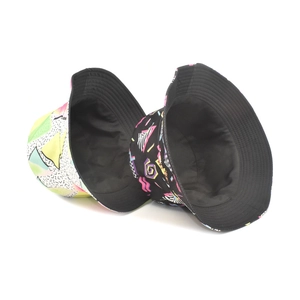 Two unisex bucket hats with vibrant neon geometric patterns and trendy graffiti prints