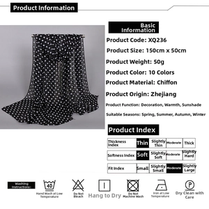 Detail view of black chiffon polka dot scarf measuring 150x50cm with fabric specs