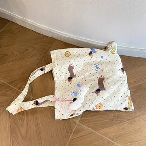 Off-white canvas dachshund tote bag with colorful polka dots and plush charm accessory