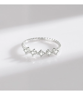 Detailed view of S925 sterling silver ring with five sparkling round cubic zirconia stones