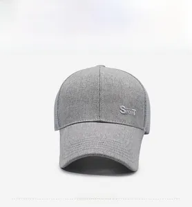 Detail view of grey mesh baseball cap with silver Sport embroidery and long brim