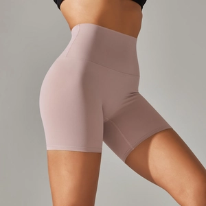 Detail view of high-waist peach-lift yoga shorts in mauve with seamless matte texture