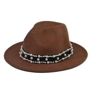 Close-up of brown wool fedora hat featuring black ribbon with triple-row pearl accents