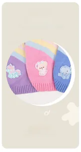 Detail of soft knit pet sweaters featuring cute unicorn, bear, and elephant embroidery