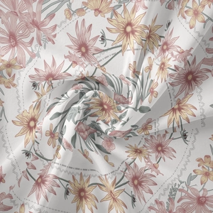Detailed macro shot of white floral tapestry fabric with soft pink daisy patterns