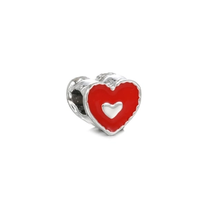 Close-up of heart-shaped silver bead with vibrant red enamel for DIY jewelry making
