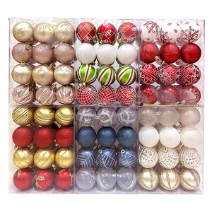 Detail of assorted 6cm Christmas ball ornaments in matte, glitter, and painted finishes