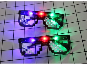 Detail showing dual pairs of LED pixel sunglasses with glowing red green and blue lights