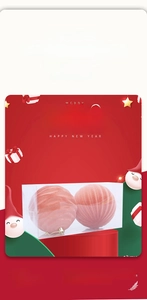 Close-up of pink flocked Christmas balls with vertical texture in a transparent gift box