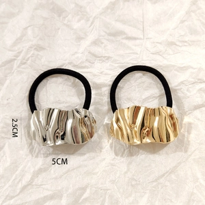 Detail showing dimensions of gold and silver hammered metal hair ties, 5cm by 2.5cm size