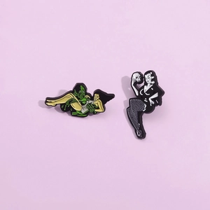Gothic enamel brooches featuring Creature from the Black Lagoon and skull lady designs
