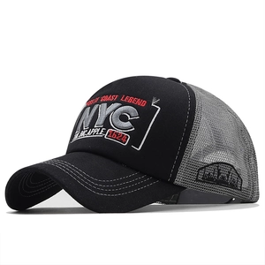 Detail of 3D NYC embroidery and breathable gray mesh on a black trucker baseball cap