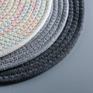 Japanese handwoven cotton cord round table mats in white and gray braided textures