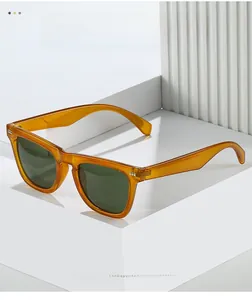 Detail of vintage amber square sunglasses with silver rivets on white geometric steps