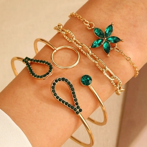 Gold multi-layer bracelet set for women featuring green crystals and floral rhinestones