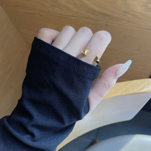 Minimalist adjustable open gold ring with geometric triangle design worn on finger