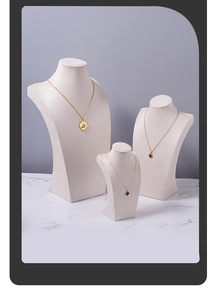 Three-piece set of beige velvet necklace busts in various sizes for jewelry display