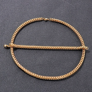 Detailed view of golden hip hop style Franco chain necklace and matching bracelet set