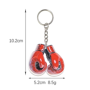 Size diagram showing 10.2cm height and 5.2cm width of the red boxing glove keychain