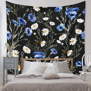 Floral wall tapestry with white daisies and blue cornflowers on a black background