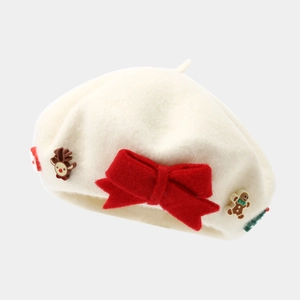 Detail of wool beret with large red festive bow and cute Christmas elk ornaments