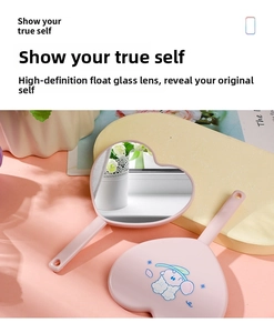Detail of pink heart-shaped handheld mirror showing cute sheep print and HD glass lens
