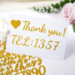 Detail of 1-inch gold glitter alphabet stickers applied on a card with floral decor