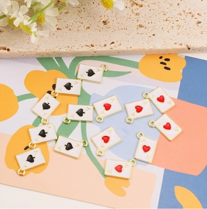 Detail of Ace of Spades and Hearts enamel charms for DIY jewelry making accessories