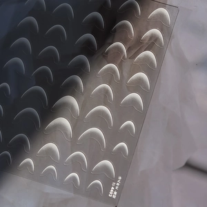 Macro shot of French gradient frosted nail stickers and TO 4403 manicure auxiliary tool