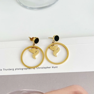 Minimalist golden fox stud earrings with black circular accents in stainless steel