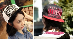 Detail view of snapback hat with Parental Advisory logo and contrast brim embroidery