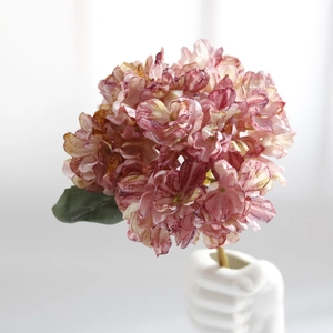 Detailed view of pink purple gradient artificial hydrangea with vintage burnt edges
