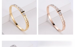 Detail of gold and rose gold hollow bangles with belt buckle design and pave stones