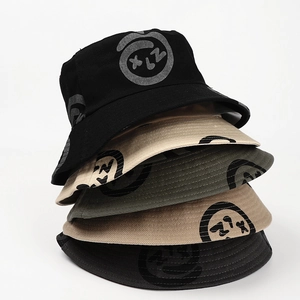 Vertical stack of printed cotton bucket hats in black, khaki, green, and brown colors