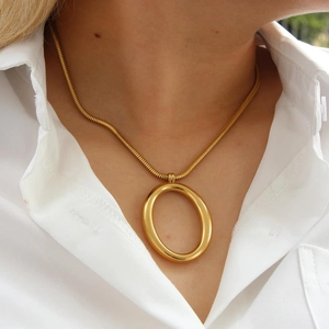 Minimalist 18k gold plated stainless steel necklace with a large oval pendant on model