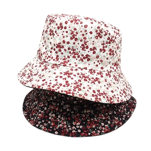 Floral print reversible bucket hats for women in black and white floral patterns