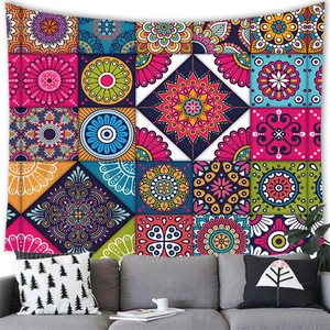 Detail of bohemian mandala tapestry featuring colorful patchwork patterns on white wall