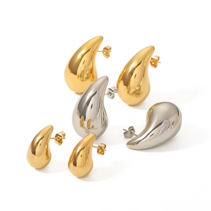 Polished 18K gold and silver water drop earrings in three pairs on white background
